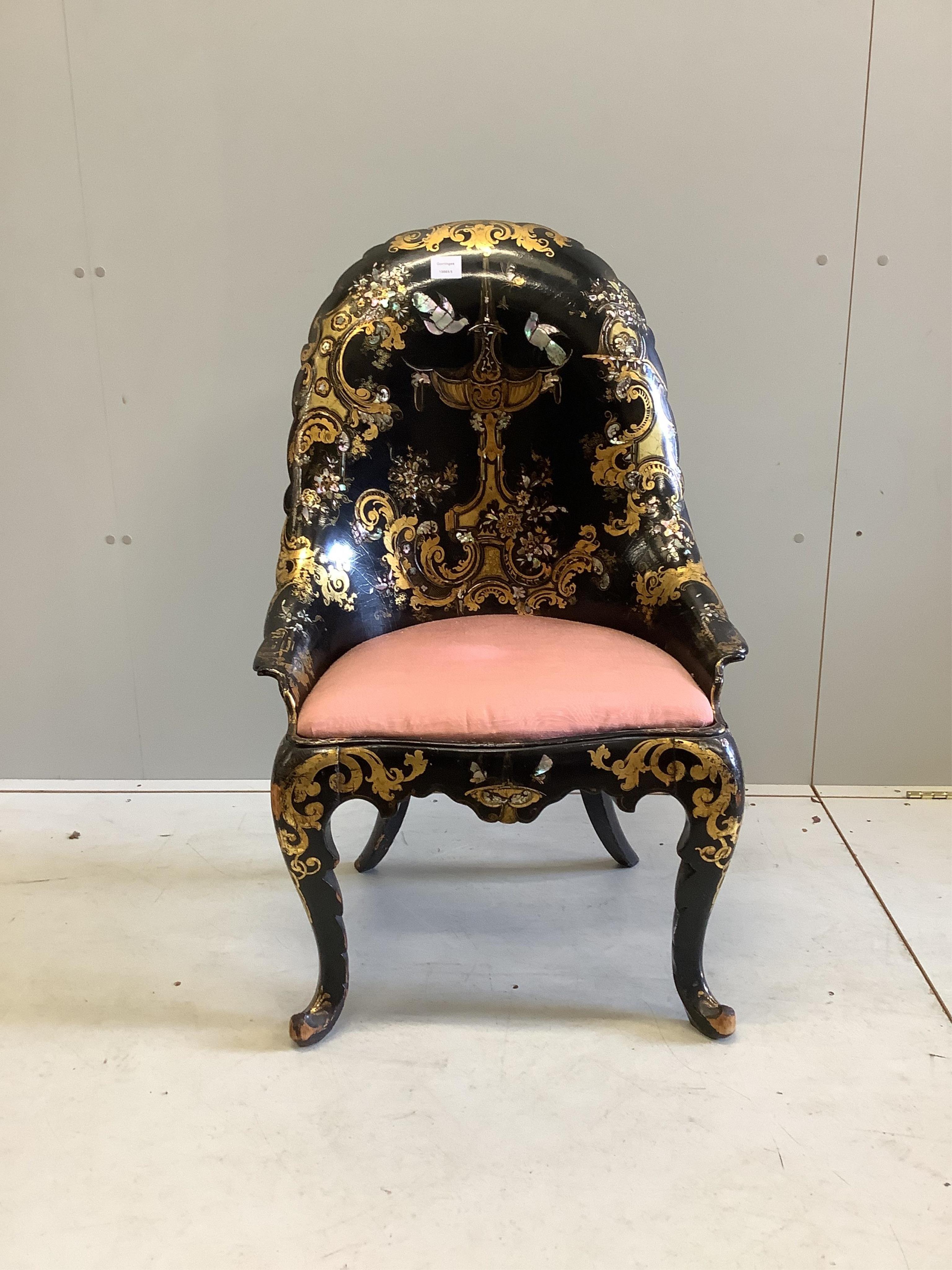 A Victorian papier mache salon chair, with mother of pearl inlay and registration number on the back, width 60cm, height 95cm. Condition - small areas of wear but essentially good condition